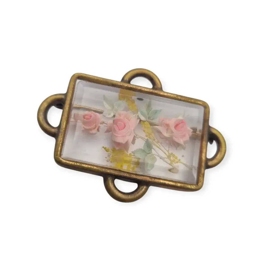 Vintage rectangular Art Deco brooch with lucite flowers from the 1940s.