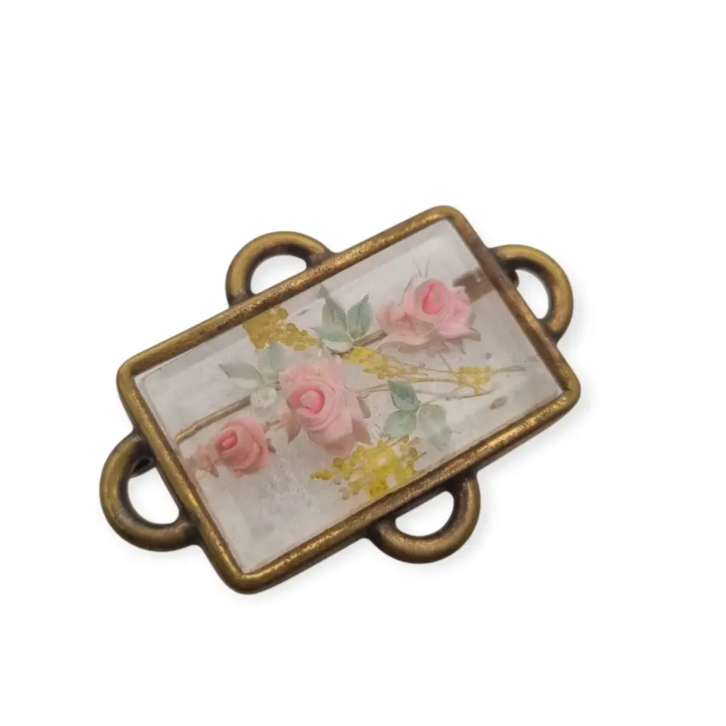 Vintage rectangular Art Deco brooch with lucite flowers from the 1940s.